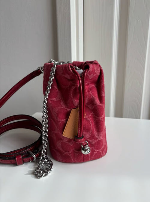 Faye Mini Drawstring Bag in Signature Denim — Silver/True Red